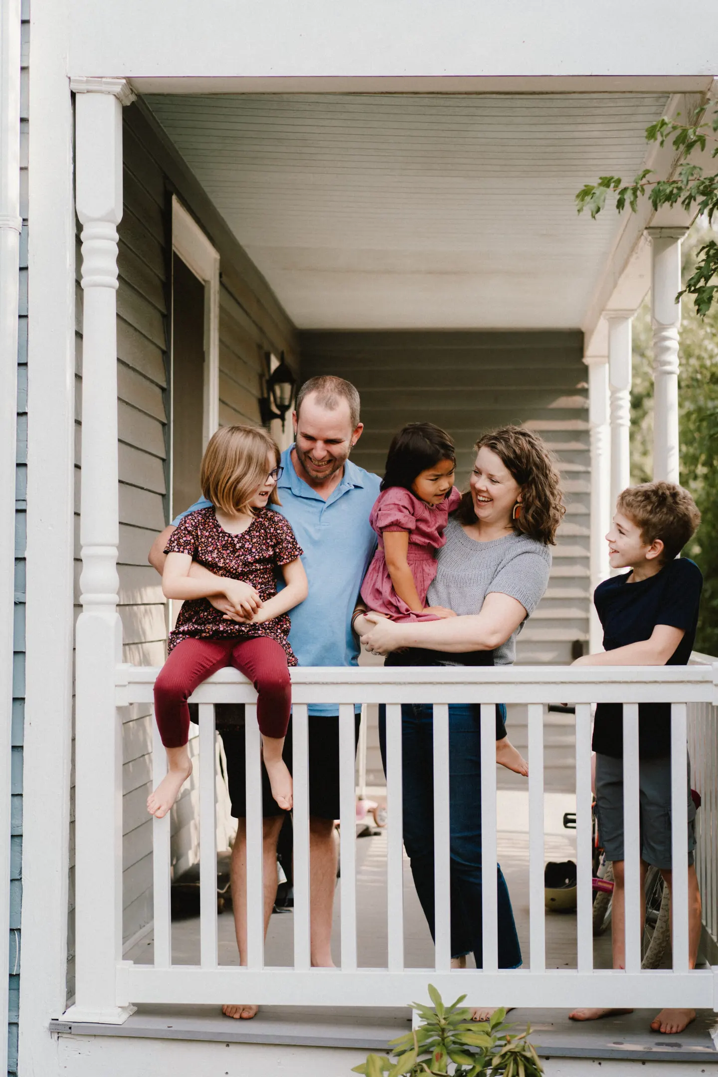 Relaxed in-home family photography Charlottesville VA - family on front porch during Home Sweet Home session