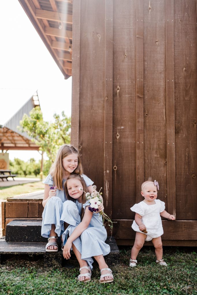 summer playful family photos at chiles peach orchard