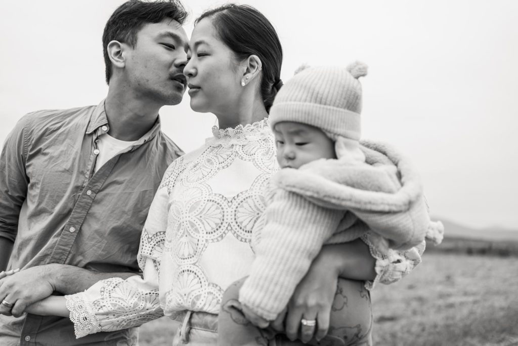 outdoor family photo pose with baby