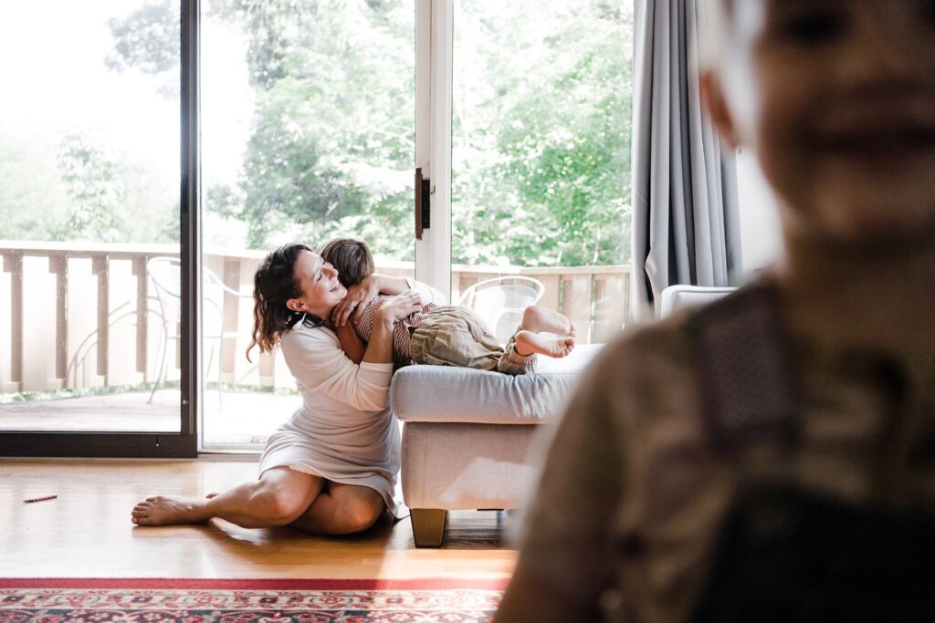 mom with kids in summer family session at home