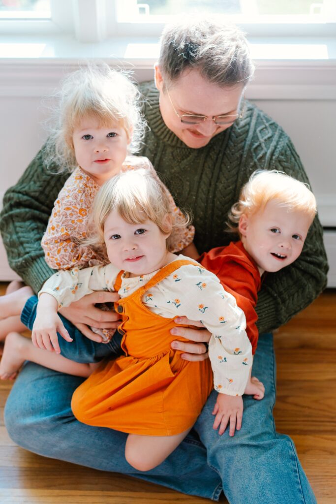 in home family photos with triplets