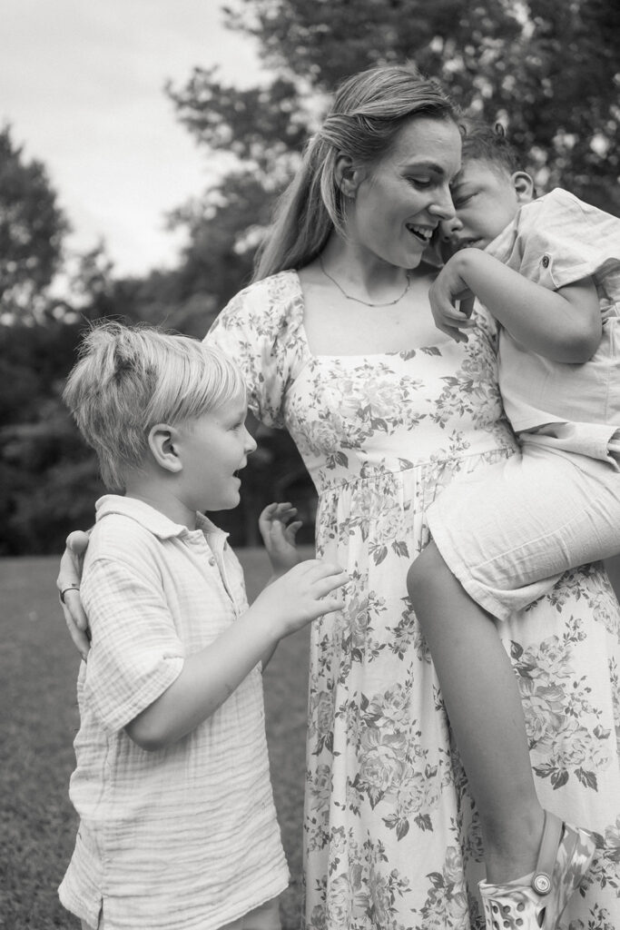 mother holding special needs child in outdoor family photo session
