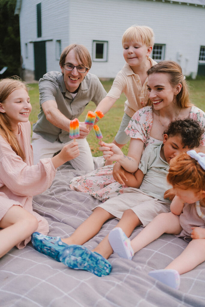 family of six with special needs kids enjoying popsicles during family mini session