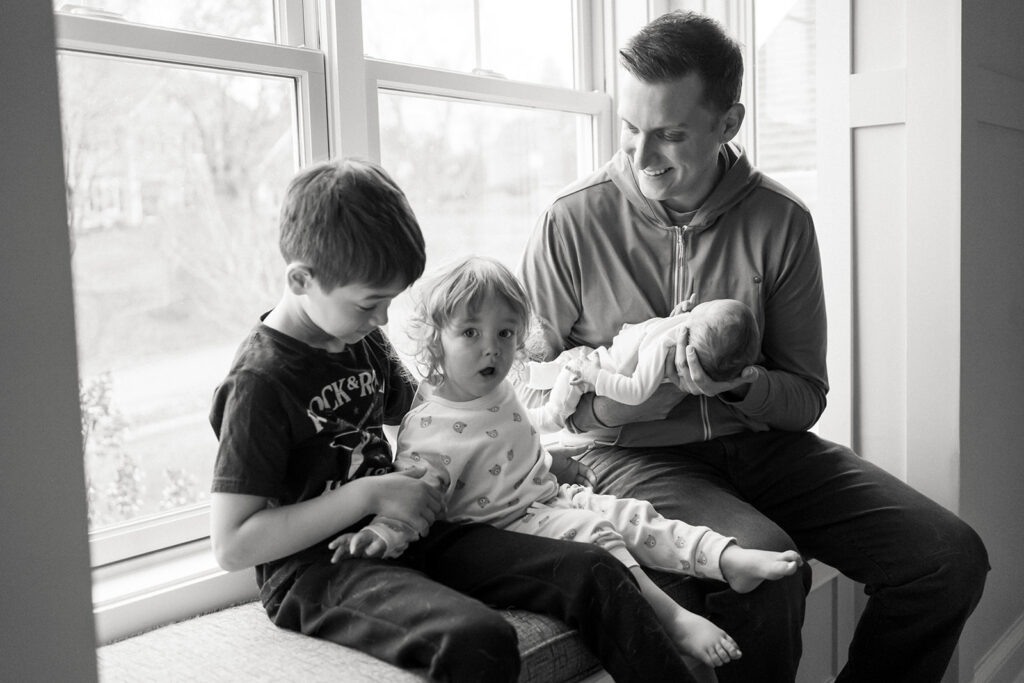 dad with newborn and two boys in Charlottesville newborn photos